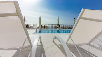 Outdoor pool, open 10:00 AM to 6:00 PM, pool umbrellas, pool loungers