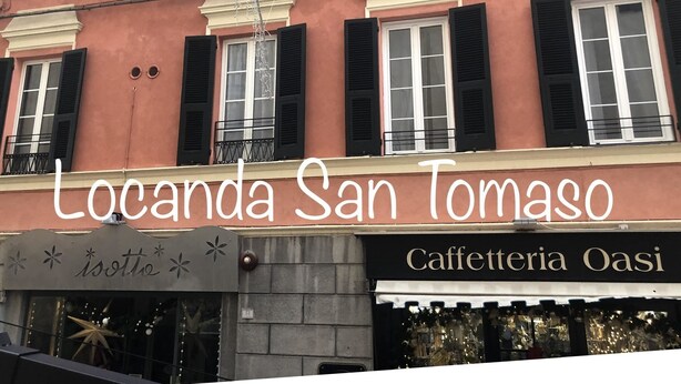 A building with the sign 'Locanda San Tomaso' and 'Caffetteria Oasi' indicating a restaurant. - Locanda San Tomaso (Pietra Ligure)