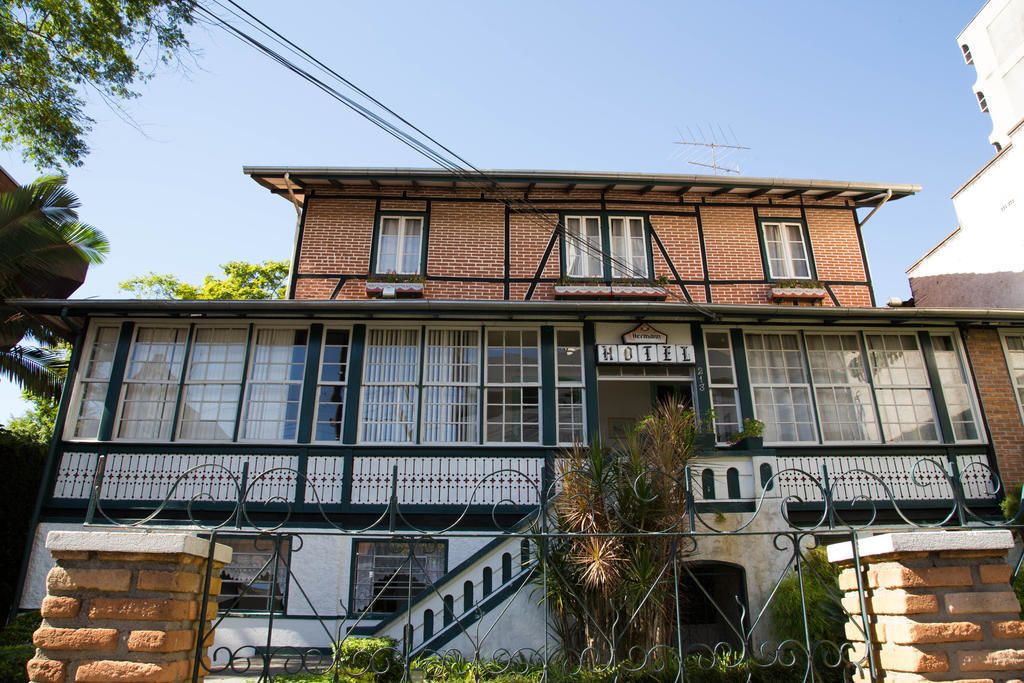 A two-story building with a sign reading "Hotel".