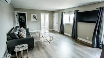 House (1 Bedroom) | Living area | TV, fireplace