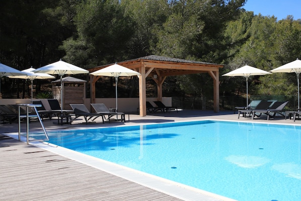 Seasonal outdoor pool, open 9:00 AM to 7:00 PM, sun loungers