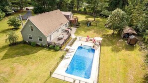 A house with a swimming pool, a deck, and a small shed. - 6BR Family Retreat - Heated Pool & Game Room - Near Lake George & Saratoga (Corinth)