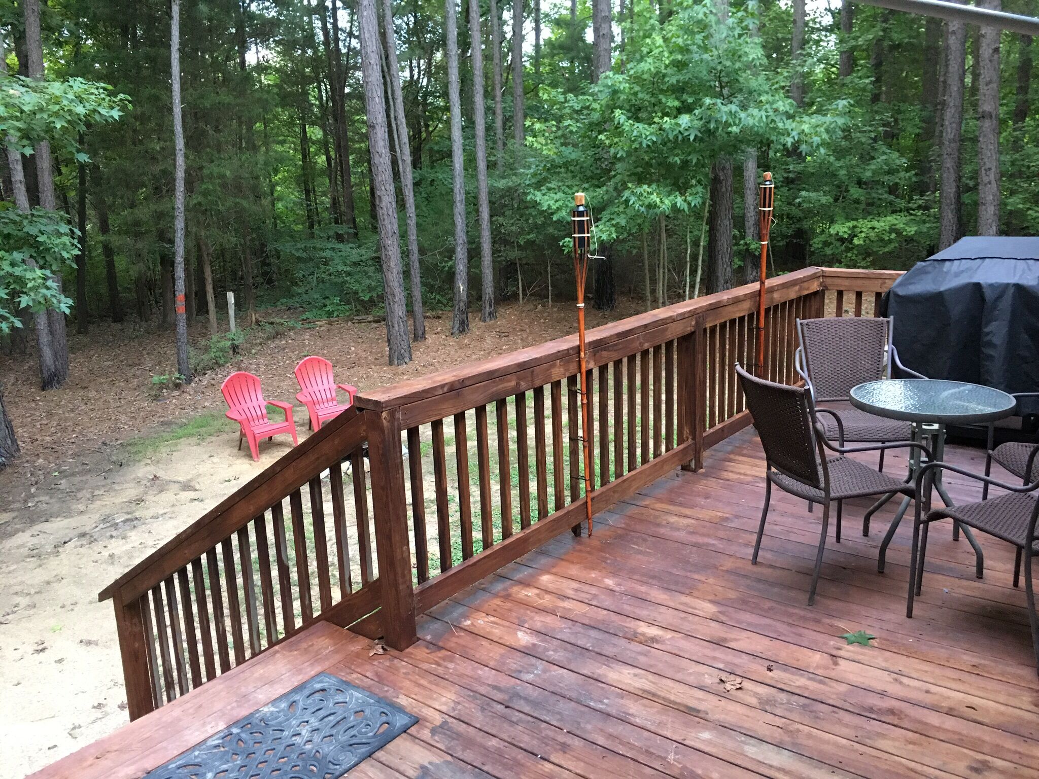 Back deck with grill. FirePit and Picnic Table are in yard. 
