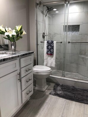 Shower, hair dryer, towels, soap
