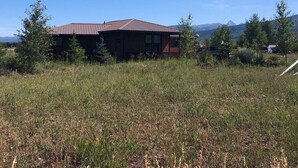 A single-story house with a brown roof and a satellite dish. - Your Basecamp In the Tetons.  (Victor)