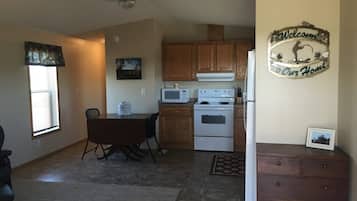 Fridge, coffee/tea maker, cookware/dishes/utensils