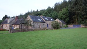 View of Gorman's Cottage from the garden, showing the driveway for Guest Cottage