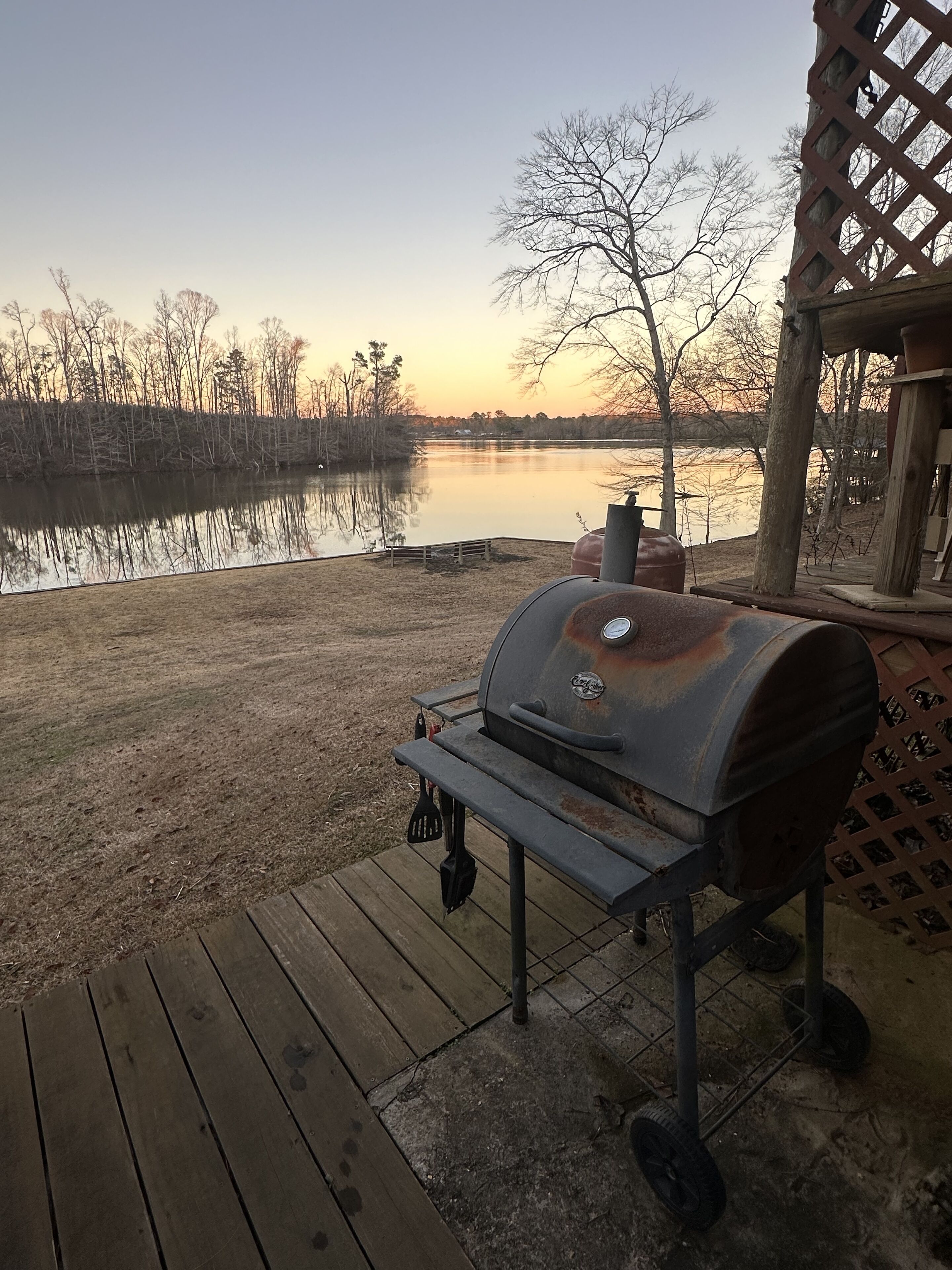 Outdoor grill area overlooking lake