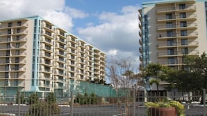 A multi-story hotel with balconies, a parking area, and a fenced construction site in the foreground. - Ocean Front, North Ocean City, Maryland  (Ocean City)