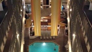 A rooftop pool area with a rectangular pool, surrounded by lounge chairs and a small table. - Weeks in September still available! Book now for a great vacation. (Myrtle Beach)