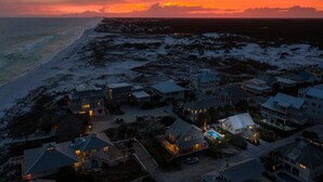 A coastal residential area with houses and a beach during sunset. - Family Favorite 'Walker House' in Grayton Beach-Private Pool (Santa Rosa Beach)