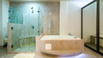 Bathtub, hair dryer, towels, shampoo