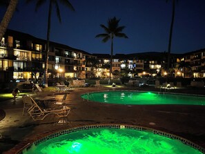 A hotel with multiple swimming pools, outdoor seating, and palm trees. - Beautiful Oceanfront, Sleeps 8. Ask About Construction Discounts Thru August2027 (Lahaina)