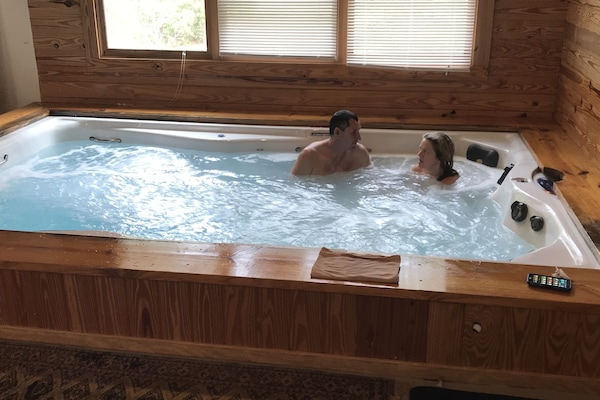 Relax in the amazing swim spa/ jacuzzi in the 900 sq ft Spa Room. 6 adults