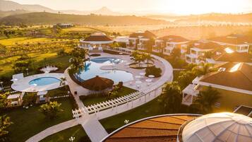 Indoor pool, outdoor pool, pool umbrellas, sun loungers