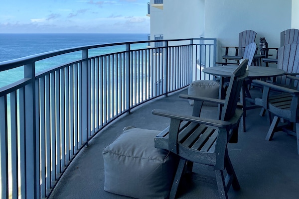 Huge balcony with seating for 6 and 2 poufs. Great place to enjoy a sunset meal!
