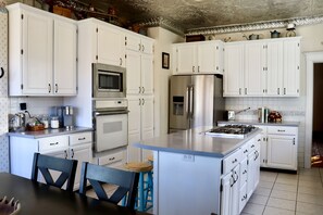 Full Kitchen, Island, and Dining Table