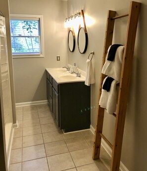 Combined shower/tub, hair dryer, towels, soap