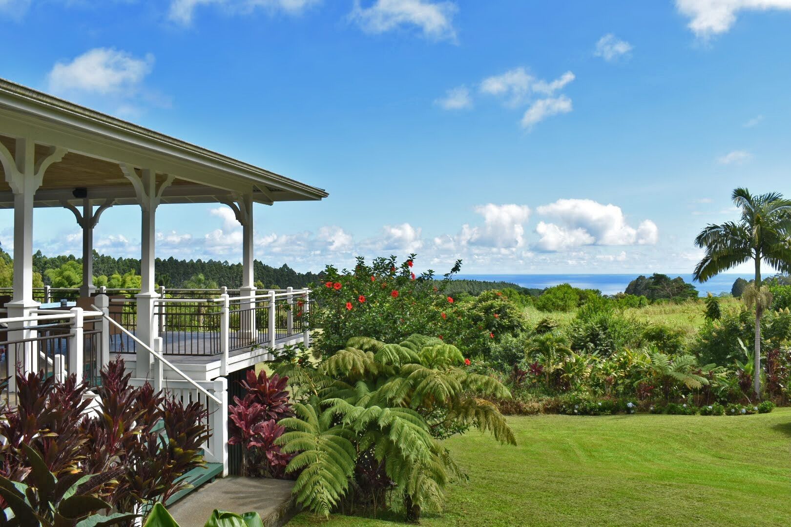 Idyllic 20-acre, ocean-view estate with streams, waterfalls, groves and gardens.