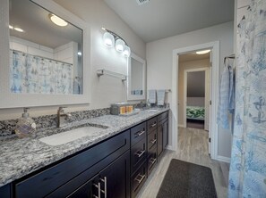 Combined shower/bathtub, hair dryer, towels, soap