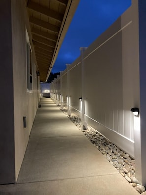 A long, well-lit corridor with a series of rooms on either side, leading towards a distant point. - Camp Pendleton Retreat with 7 person SPA 5bd 2 bath sleeps 12 (Oceanside)