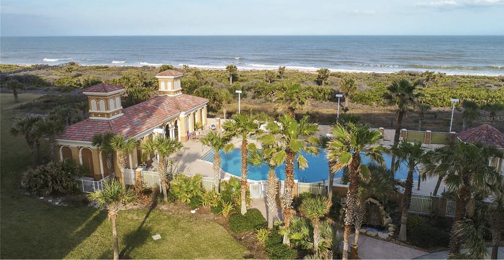 Beach club pool and clubhouse - aerial view