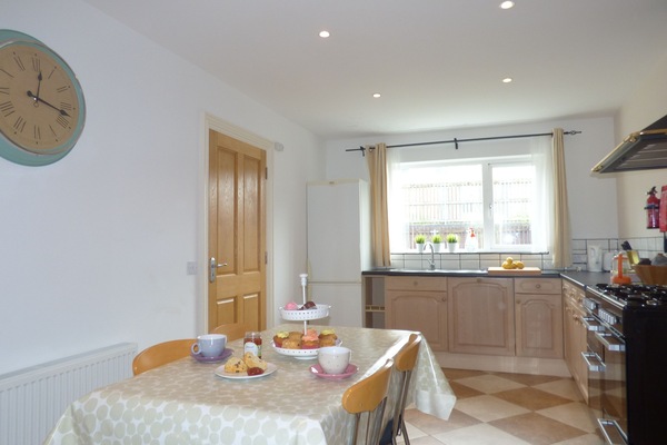 Kitchen, fridge freezer, seating for 9, child's high chair, dishwasher, stove