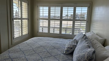 2 bedrooms, memory foam beds, iron/ironing board, travel crib