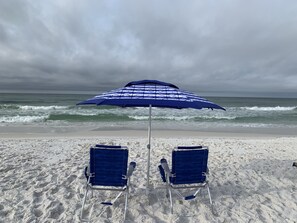 On the beach, sun-loungers