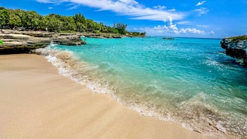 On the beach, sun loungers, beach towels