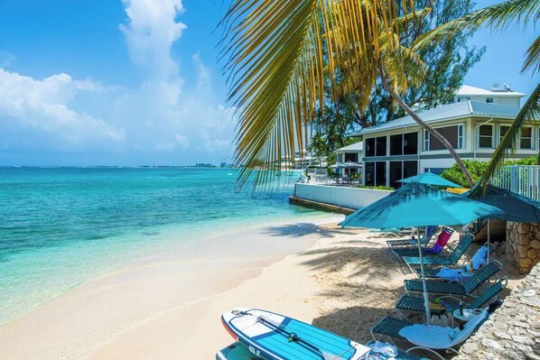 On the beach, sun loungers, beach towels