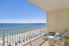A balcony with a view of a beach and ocean. - Beachfront Condo with Oversized Balcony & Gulf Views! Hot Tub-In/Out Pool (Gulf Shores)