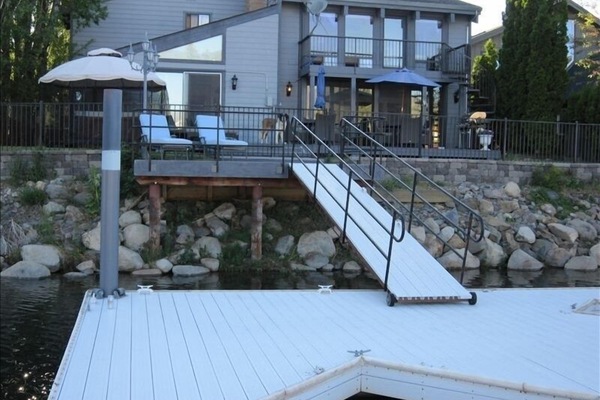 View of rear of home from private boat dock