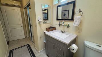 Shower, hair dryer, towels, soap