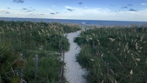 A sandy path leading to a beach with tall grasses and a clear blue sky. - Admiral’s Row B2 - 2nd floor corner condo.  Clean, comfy and relaxing (Hilton Head Island)