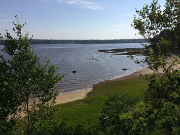The sand beach, high tide, seen from the trail out to the end of the Point.