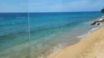 On the beach, sun-loungers, beach towels