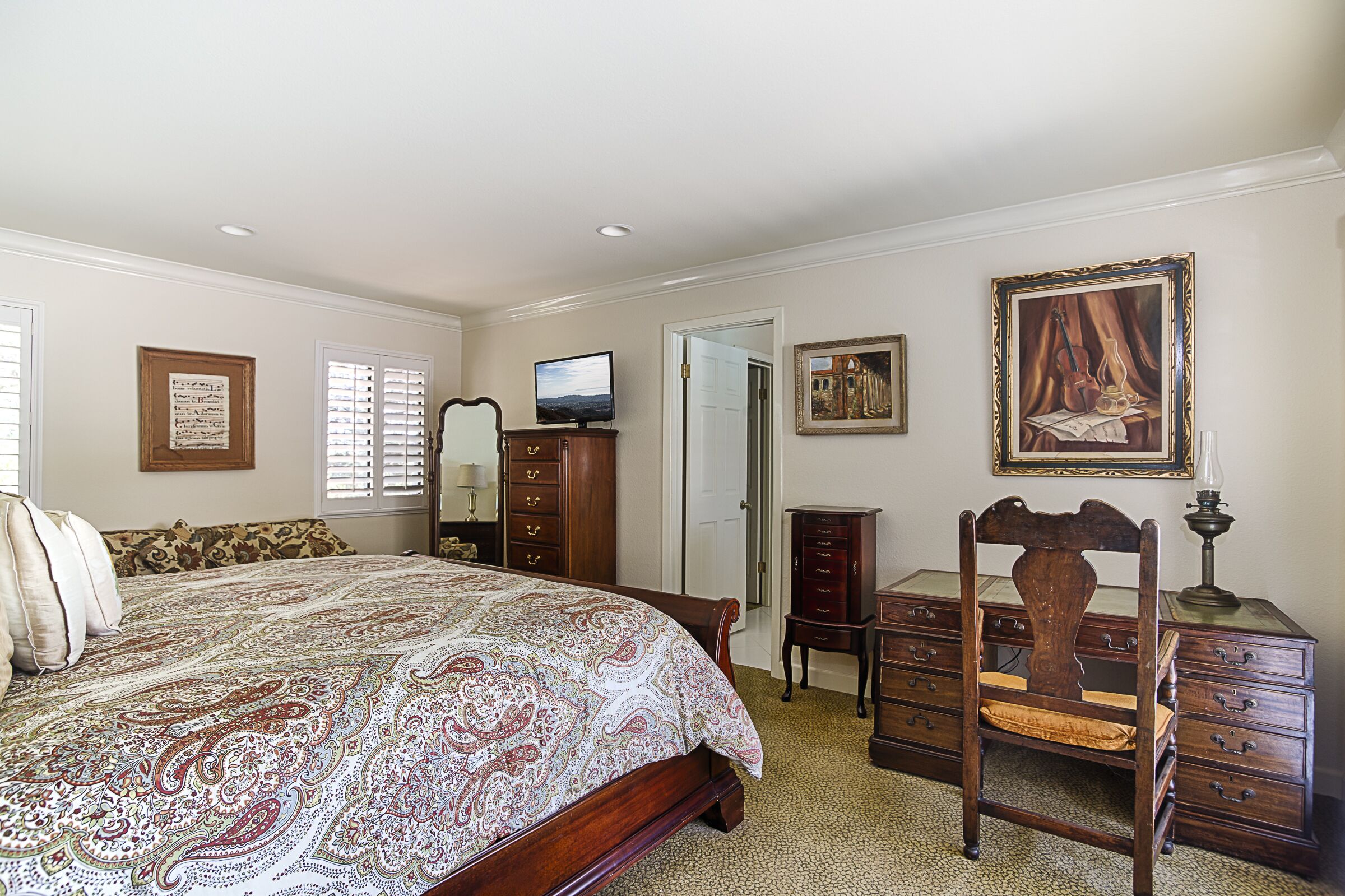 Bedroom with adjoining bath, king size bed, tv