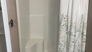 Shower, hair dryer, towels, toilet paper
