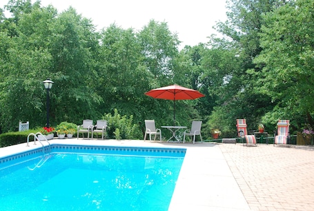 Outdoor pool, a heated pool. A Cozy Cottage Near the Heart of All Louisville Attractions!