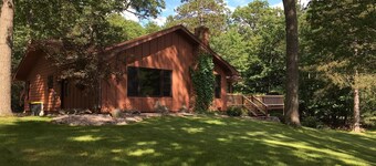 Escape to the Northwoods at this picturesque Sand Lake home