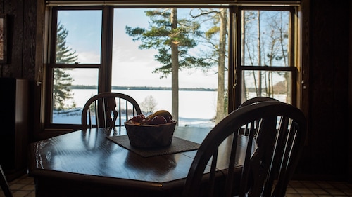 Escape to the Northwoods at this picturesque Sand Lake home