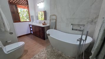 Combined shower/tub, hair dryer, towels, soap