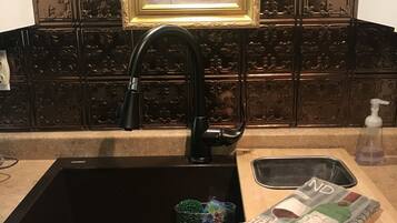 Bathtub, hair dryer, towels, soap