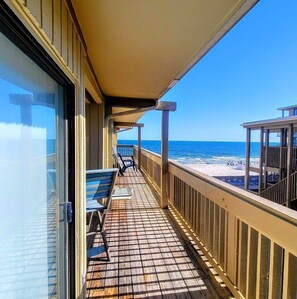 A wooden deck with a railing overlooking a beach. - On the Beach! 2BR/1B - Low Rise/Low Rates - Steps to the sand-Gulf Village 209! (Gulf Shores)