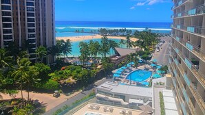 A resort with a large pool area, multiple swimming pools, and a beach view. - Family friendly unit with fabulous Ocean/Lagoon view  (Honolulu)