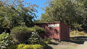 A wooden structure with a sign indicating 'Mendocino View Parking'.