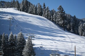 A snowy mountain slope with ski lifts and snow-covered trees. - Gorgeous Mountain Views in Downtown Red River (Red River)