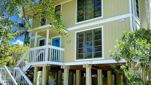 A two-story building with a balcony and a covered porch area. - Fantastic Island Getaway at Sunset Captiva 48 (Captiva)