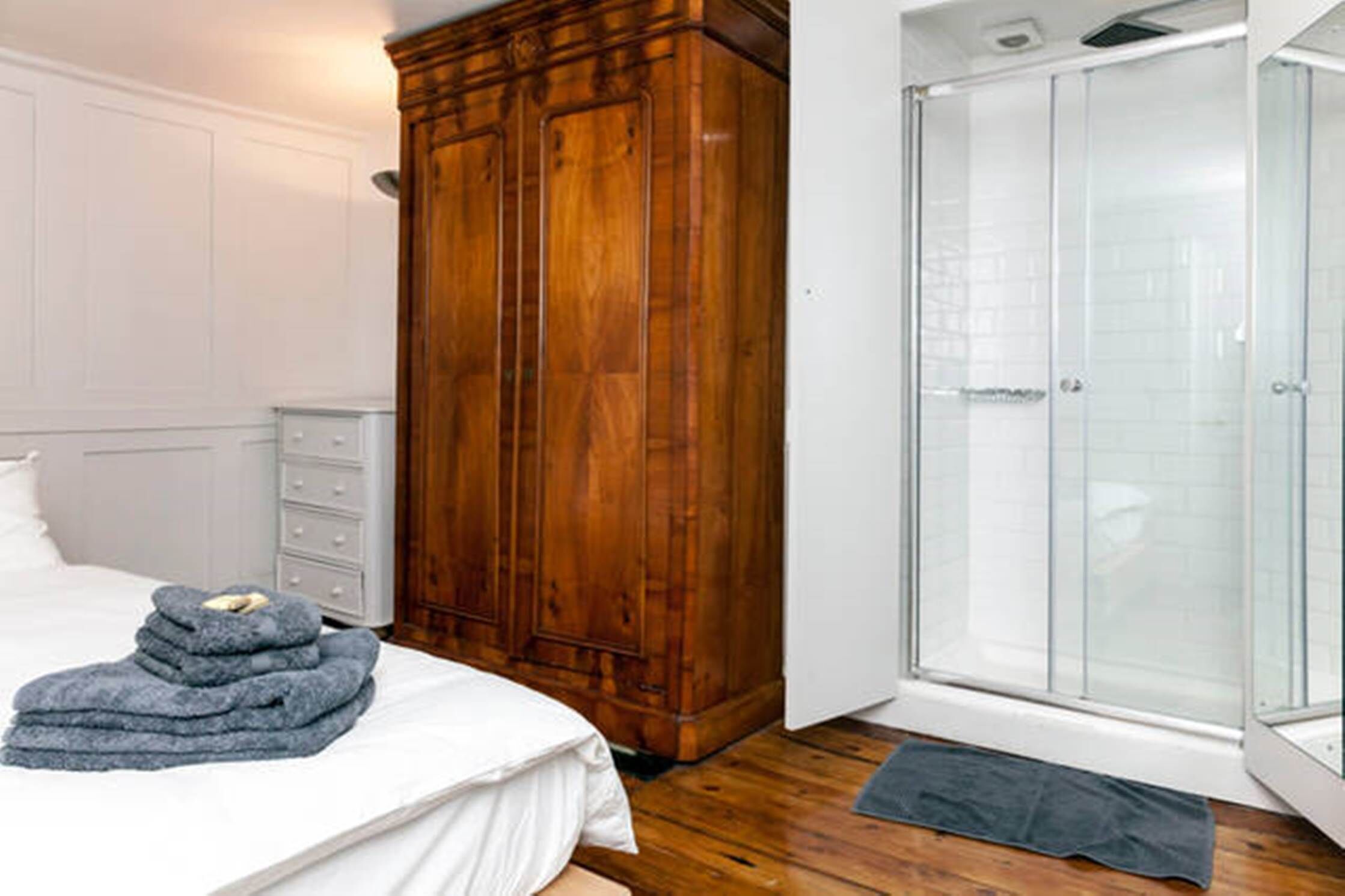 the hidden shower in the bigger bedroom